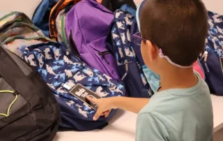 Child Choosing Backpack
